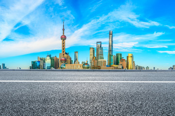 Fototapeta na wymiar Urban buildings and empty asphalt roads in Shanghai