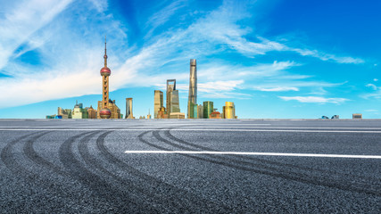 Urban buildings and empty asphalt roads in Shanghai
