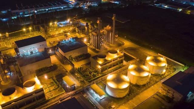 Hyperlapse Timelapse Aerial view night light oil refinery terminal is industrial facility for storage of oil and petrochemical. oil manufacturing products. power electric plant. footage video 4k.