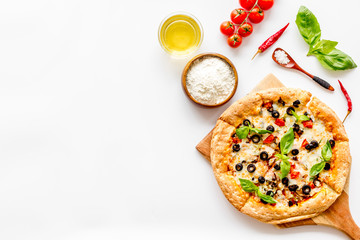 Traditional italian food: pizza on white background top view copy space