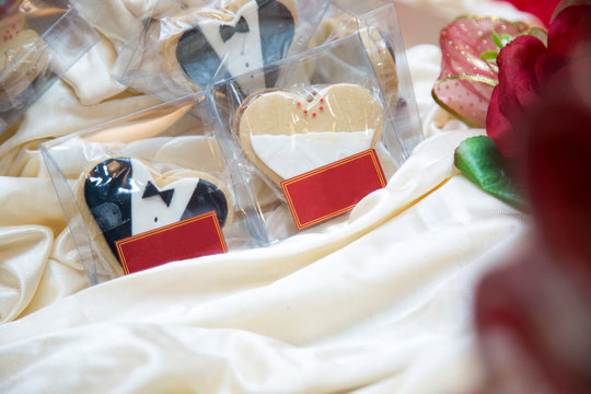 Bridal couple bride groom cookies cake. Man woman cake symbol of love and happiness - Powered by Adobe