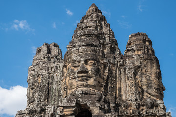 Fototapeta na wymiar The face tower on the south gate to Angkor Thom the ancient capital city of Khmer empire in Siem Reap, Cambodia.