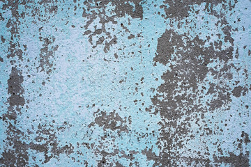 Blue cement wall Abrasives due to prolonged exposure to sunlight.