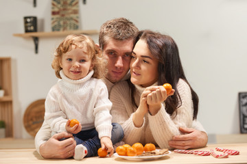 happy family celebrates Christmas in the kitchen, love, sincerity and warmth