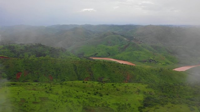 Flying through the clouds. The drone show footage of the clouds and reveals the the river snaking through the mountains. River Donga of the Mambilla plateau.