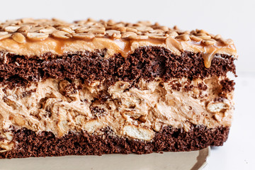 Cake with peanuts and caramel, close-up. Homemade cakes, small business.