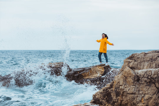 Woman Enjoying Storm Weather At Sea