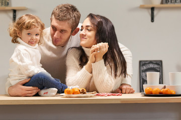 Happy Christmas family celebrate in the kitchen. Love and New Year celebration.