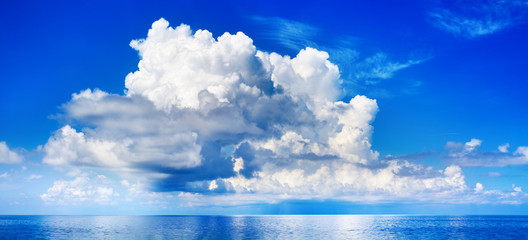 White cumulus clouds in blue sky over sea landscape, big cloud above ocean water panorama, horizon, beautiful tropical sunny summer day seascape panoramic view, cloudy weather, cloudscape, copy space - obrazy, fototapety, plakaty