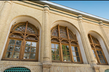 Obraz premium Renovated wooden arch windows, Masoudieh historic mansion from Qajar dynasty, built in 1879, Tehran, Iran