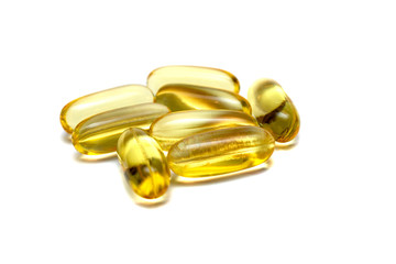 Vitamin e omega 3 fish oil yellow pills vitamins sport nutrition healthy on the white background isolated close up