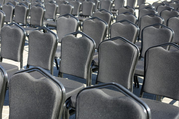 Obraz premium Rows of gray chairs. Street concert, conference, presentation.