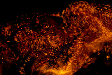 flame of fire with sparks on a black background