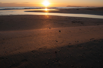 Fototapeta na wymiar sunset view sea , sun and golden sand on the beach