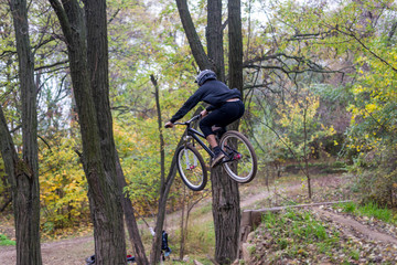 Extreme cycling concept: mountain bike rider makes a jump.