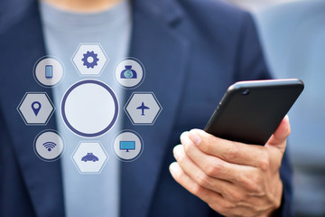 Businessman holding cell phone using Mobile phone or Smart phone Telephone to call phone with Social media Icon technology by WiFi internet  Network digital