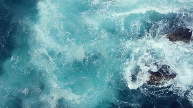 Aerial view of Atlantic ocean with crashing waves.