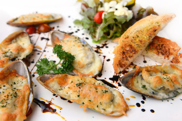 Seafood. Baked New Zealand Mussels with Cheese