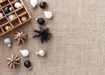 Close up glossy christmas balls with a paper christmas trees