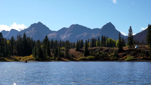 Woman sculling in the Molas Lake of the San Juan Mountains in Colorado