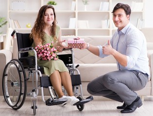 The man making marriage proposal to disabled woman on wheelchair