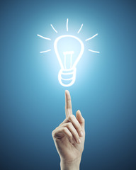 Hand pointing to drawing lamp