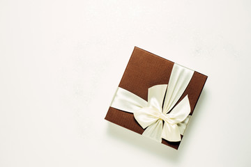 Brown gift box on a white background, top view