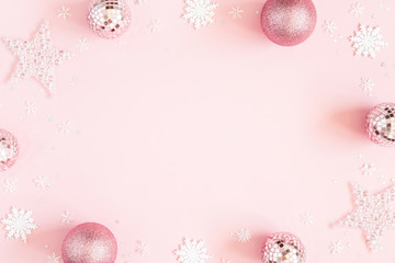 Christmas composition. White decorations on pastel pink background. Christmas, winter, new year concept. Flat lay, top view, copy space