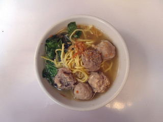 Variance of meatballs in white bowl