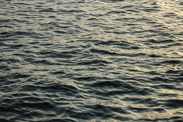 Creative background: ripples on the water, selective focus