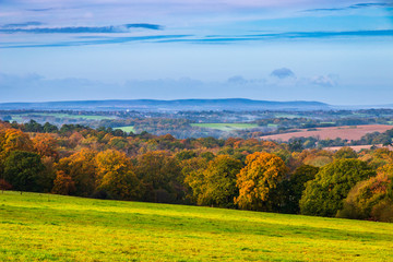 Autumn view of the high weald and the distant south downs in East Sussex from Tent Hill