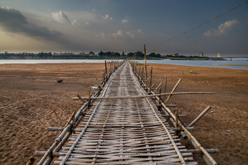 Fototapeta premium old traditional bamboo wooden bridge across Mekong river (from Koh Paen island to Kampong Cham), Cambodia