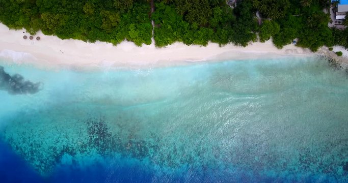 Amazing wallpaper of tropical bay with blue turquoise pattern of lagoon washing white sand beach in Antigua