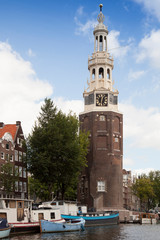 Fototapeta na wymiar The Montelbaanstoren Tower at the Waalseilandsgracht, Amsterdam, Holland, Netherlands
