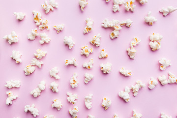 Fresh popcorn isolated on pink background top view. Composition with copy space.