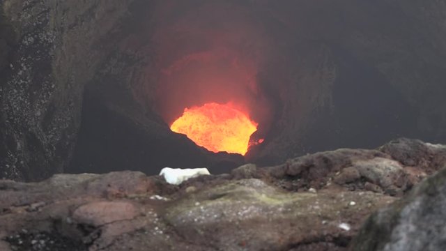 Bubbling Lava Lake From Above.  Down Angle Static Shot of Active Lava Lake inside Volcano Below