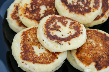 homemade cheesecakes closeup on a black plate