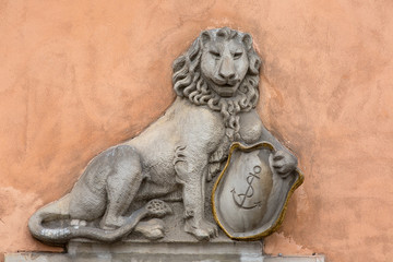 Old Town Market Place, decorative facade of tenement houses, stone lion, Warsaw, Poland