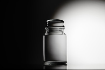 Empty glass jar on a white background