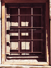 Old rustic window with grilles