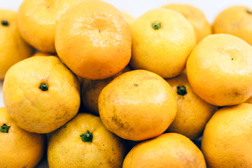 Fresh mandarin oranges (Citrus reticulata), vegetarian concept.