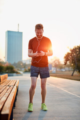 Modern young man working out in an urban park.