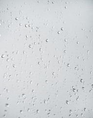 Rain drops on window glasses surface.