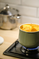 pumpkin cooking process. Boiled pumpkin in a pot.