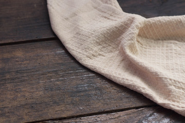 Kitchen towel on wooden table copy space