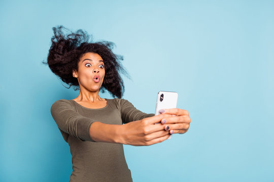 Close up photo of funny funky afro american girl feel impressed expression imagine she on roller coaster take selfie for blog blogger influencer wear style outfit isolated blue color background