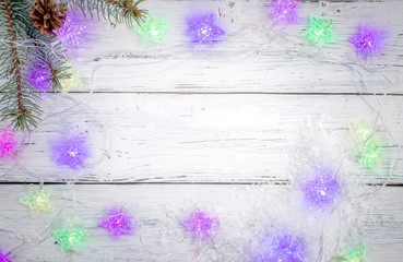 Fototapeta na wymiar Christmas background with fir tree branch and garland