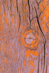 Close up of wooden background. Purple/orange.
