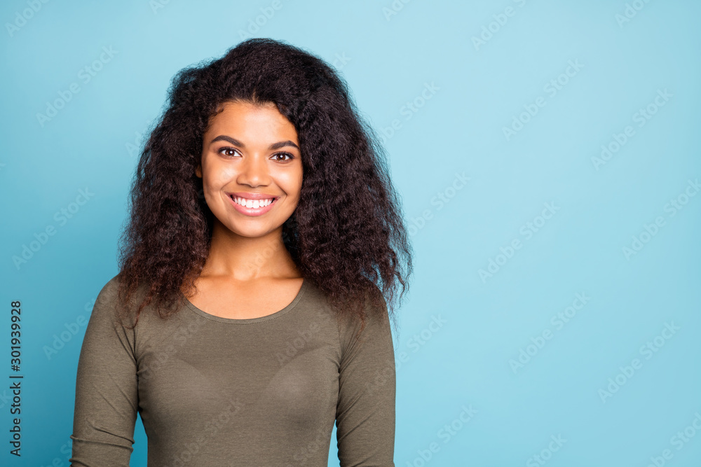 Sticker Portrait of positive cheerful lovely dark skin girl have fun weekends enjoy free time with friends listen look wear green outfit isolated over blue color background