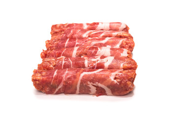 Chevapchichi in bacon isolated on white background.